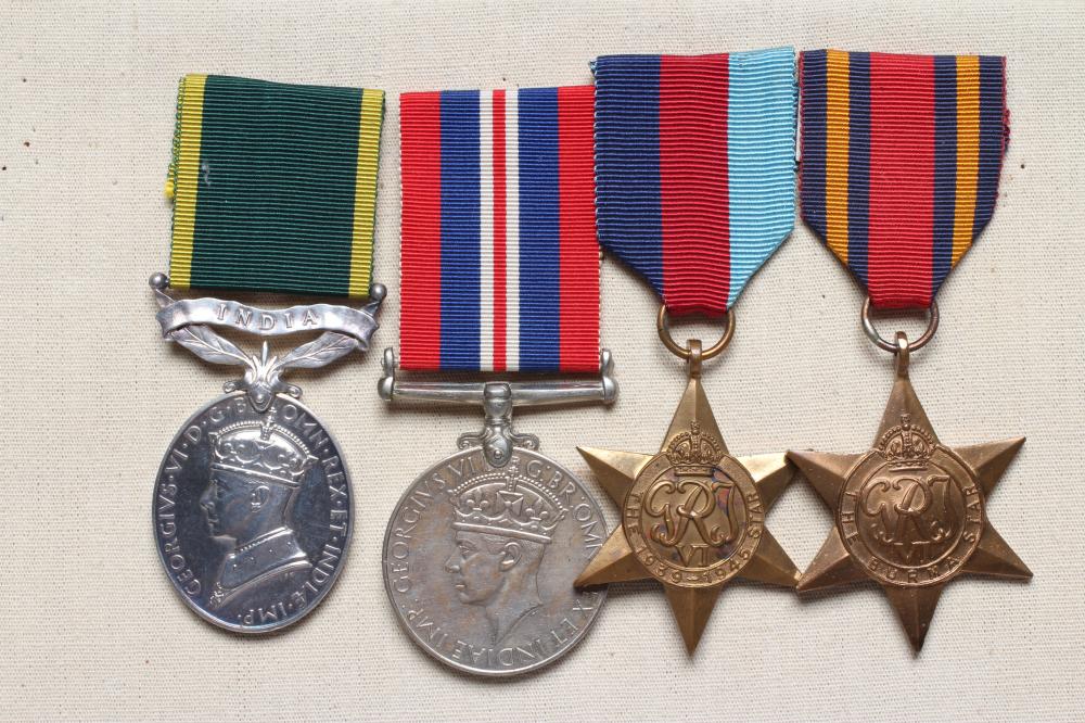 A GROUP OF FOUR MEDALS, comprising an India Efficiency Medal, a 1939-45 Star, a Burma Star and a Image