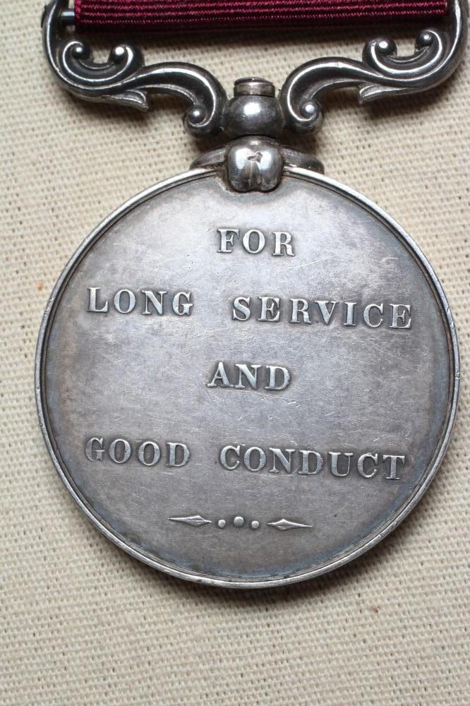 A VICTORIAN ARMY LONG SERVICE & GOOD CONDUCT MEDAL, 1st type, awarded to John Anderson of the 3rd Image