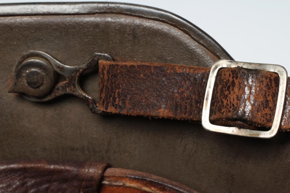A GERMAN M16 STEEL HELMET with large external lugs and leather interior lining with strap (Est. plus Image