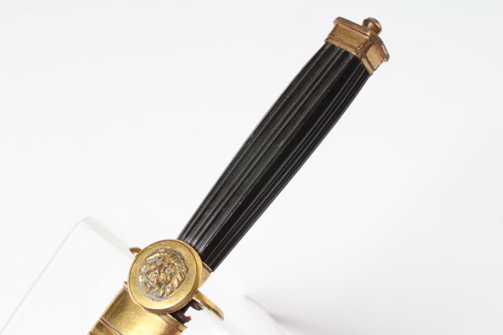 A GEORGIAN OFFICER'S DIRK with 8 5/8" stiletto blade, gilt cross guard with lion lozenge, fluted Image