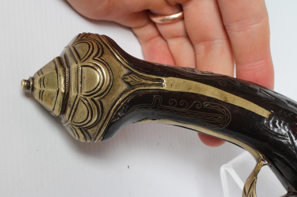 A FLINTLOCK PISTOL with 8 1/4" barrel, foliate etched lock, carved and white metal inlaid stock, Image