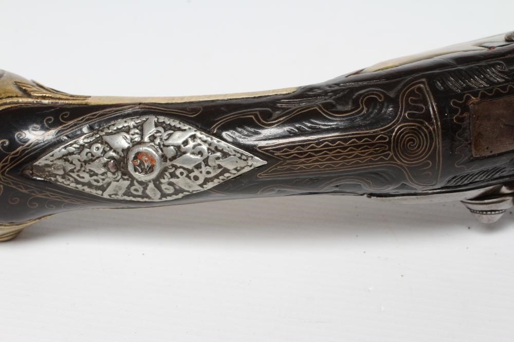 A FLINTLOCK PISTOL with 8 1/4" barrel, foliate etched lock, carved and white metal inlaid stock, Image