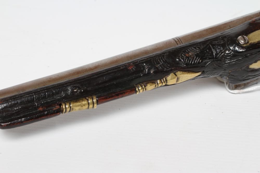 A FLINTLOCK PISTOL with 8 1/4" barrel, foliate etched lock, carved and white metal inlaid stock, Image