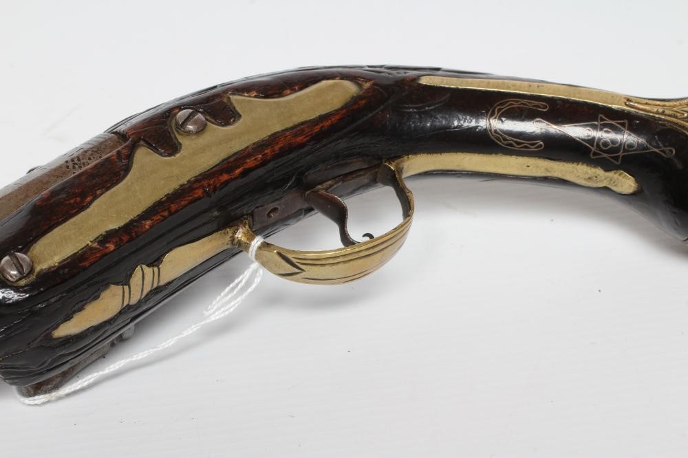 A FLINTLOCK PISTOL with 8 1/4" barrel, foliate etched lock, carved and white metal inlaid stock, Image