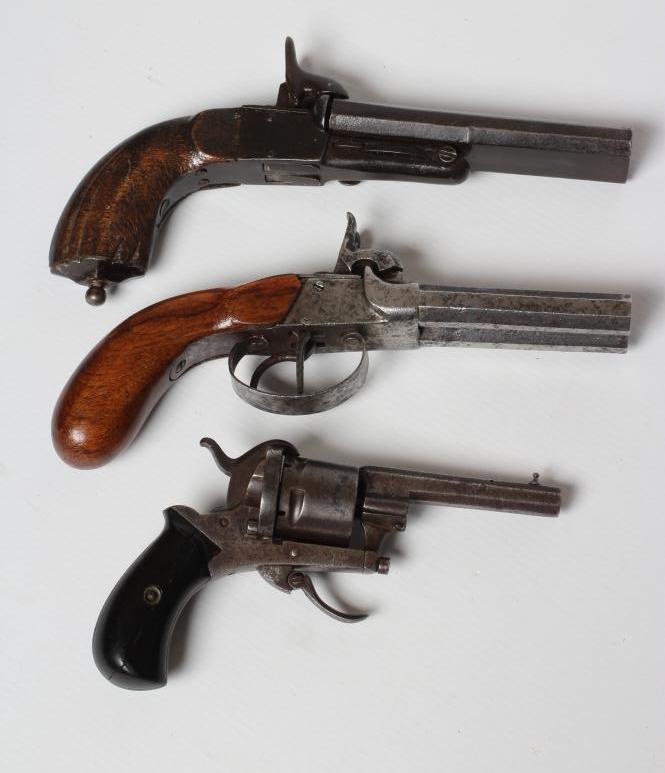 THREE ANTIQUE PISTOLS, comprising a European pinfire revolver, a double barrelled pinfire pistol and Image