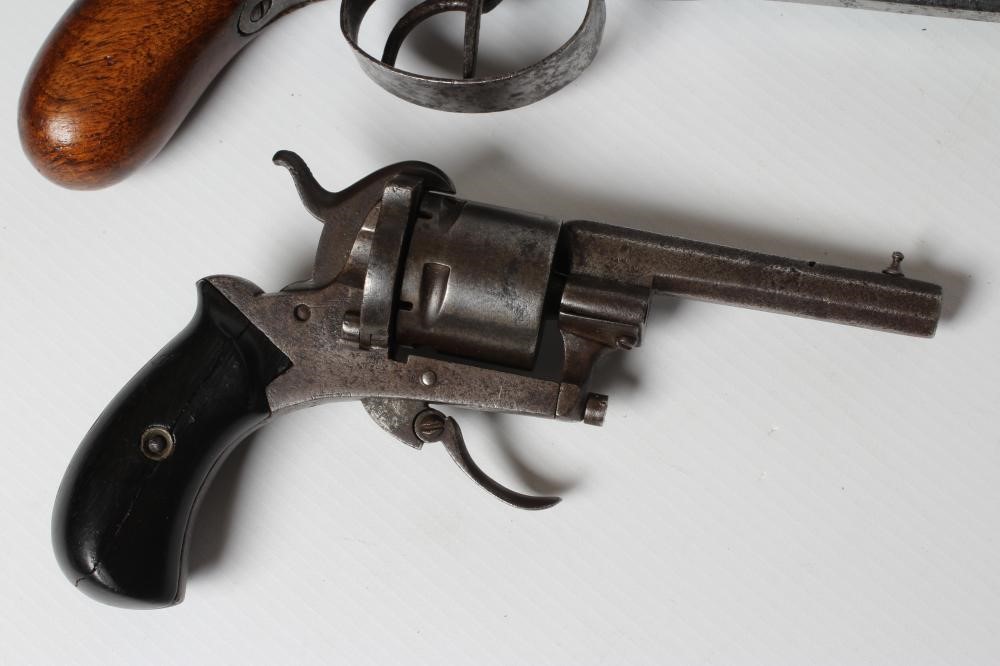 THREE ANTIQUE PISTOLS, comprising a European pinfire revolver, a double barrelled pinfire pistol and Image