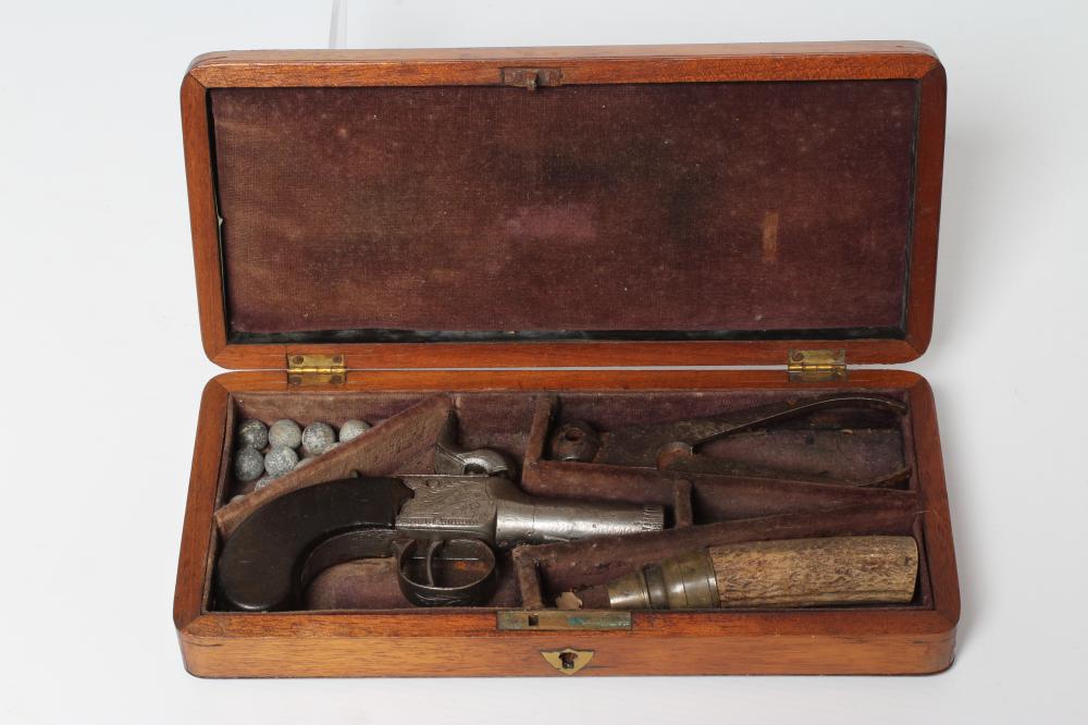 A CASED PERCUSSION POCKET PISTOL with 1 3/4" barrel, foliate etched action and walnut slab grip, 6" Image