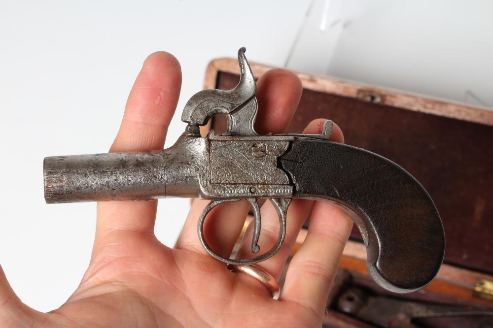 A CASED PERCUSSION POCKET PISTOL with 1 3/4" barrel, foliate etched action and walnut slab grip, 6" Image