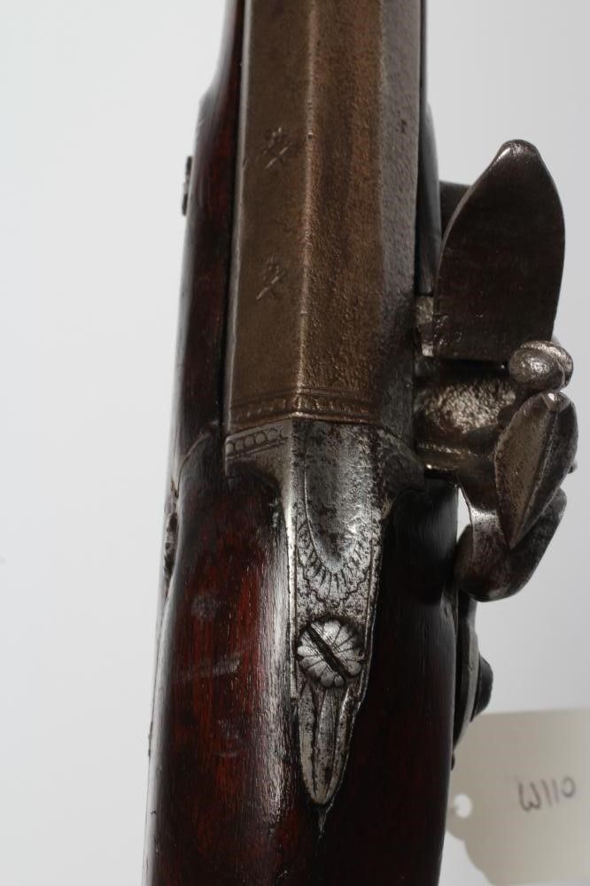 A FLINTLOCK MUSKET, the 35 3/4" barrel octagonal at the breech, stepped action, swan cock, brass Image