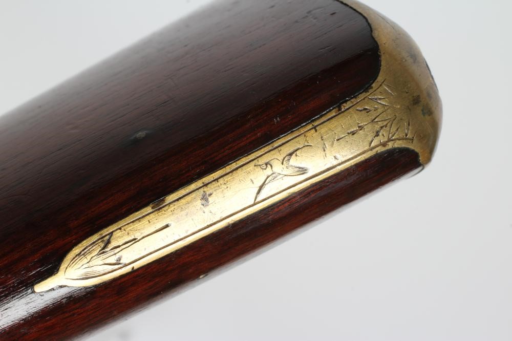 A FLINTLOCK MUSKET, the 35 3/4" barrel octagonal at the breech, stepped action, swan cock, brass Image