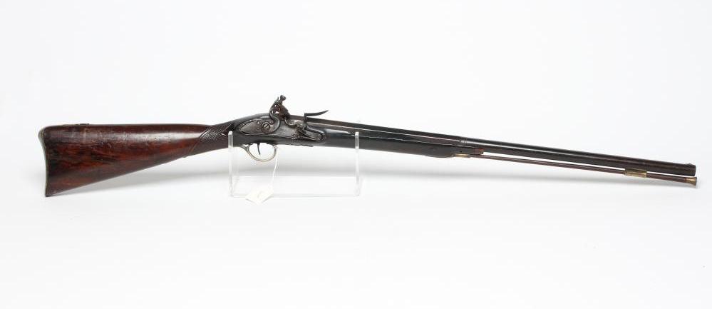 A FLINTLOCK MUSKET by Ward, the 26" barrel octagonal at the breech, walnut stock, brass furniture Image