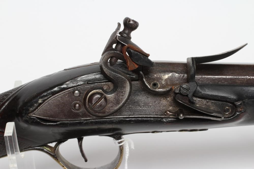 A FLINTLOCK MUSKET by Ward, the 26" barrel octagonal at the breech, walnut stock, brass furniture Image