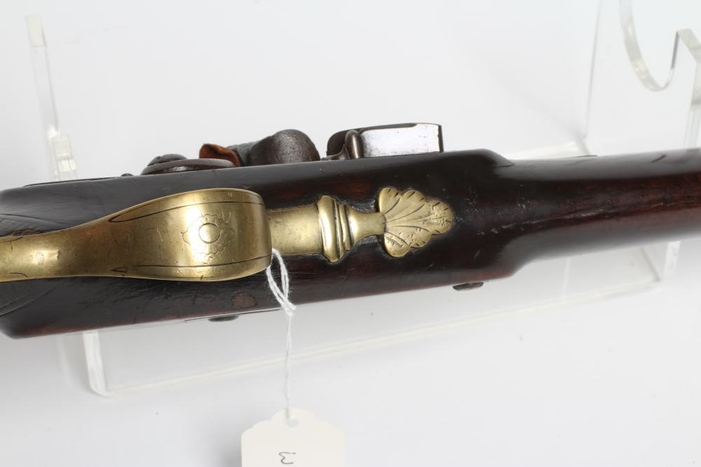 A FLINTLOCK MUSKET by Ward, the 26" barrel octagonal at the breech, walnut stock, brass furniture Image