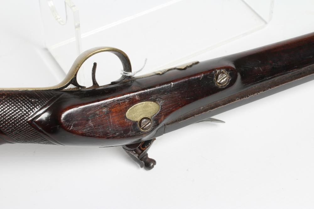A FLINTLOCK MUSKET by Ward, the 26" barrel octagonal at the breech, walnut stock, brass furniture Image