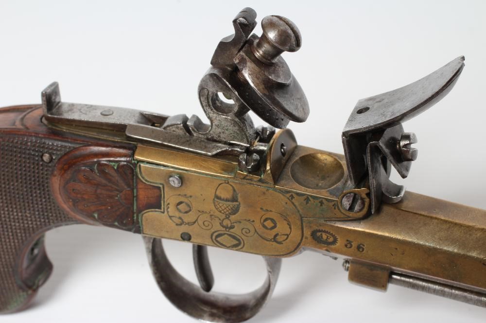 A BRASS FLINTLOCK TOP ACTION PISTOL with 3 1/2" octagonal barrel Image