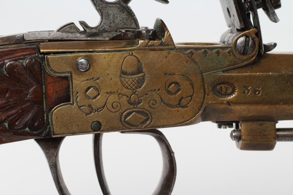 A BRASS FLINTLOCK TOP ACTION PISTOL with 3 1/2" octagonal barrel Image