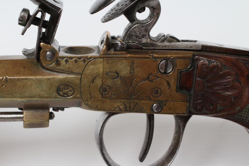A BRASS FLINTLOCK TOP ACTION PISTOL with 3 1/2" octagonal barrel Image