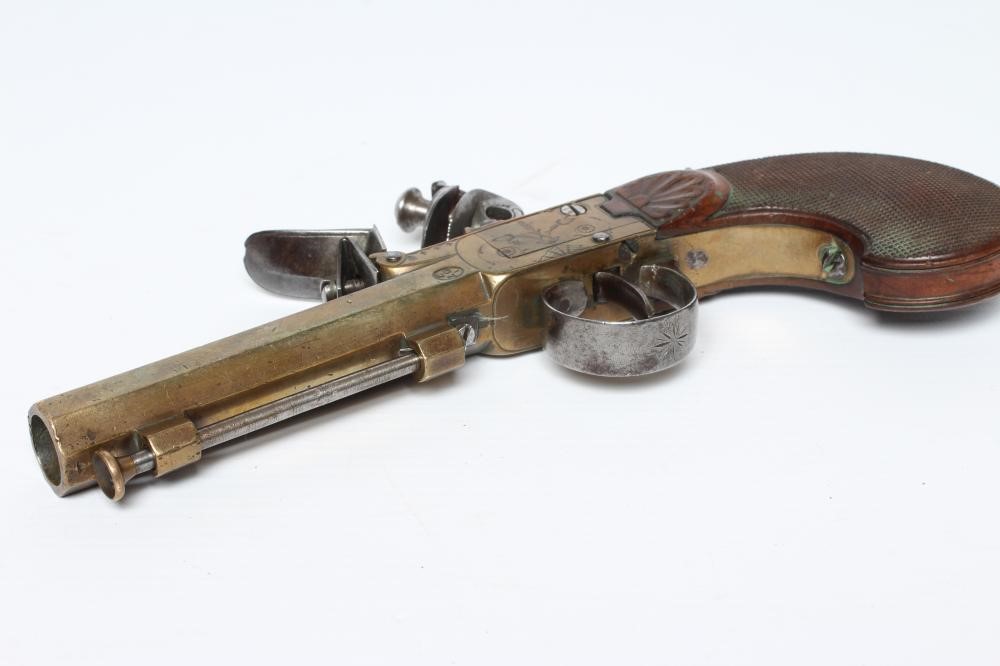 A BRASS FLINTLOCK TOP ACTION PISTOL with 3 1/2" octagonal barrel Image
