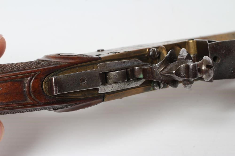 A BRASS FLINTLOCK TOP ACTION PISTOL with 3 1/2" octagonal barrel Image