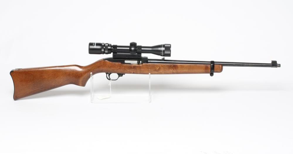 A RUGER 10/22 SEMI-AUTOMATIC RIFLE, the 18 1/4" barrel screw cut for moderator, iron sights, wood Image