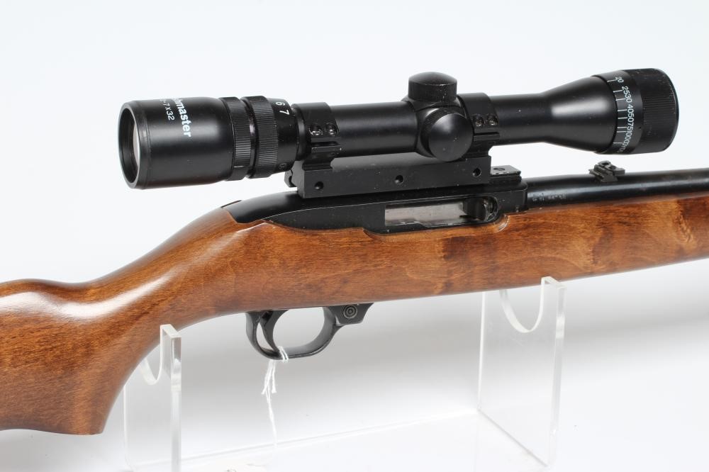 A RUGER 10/22 SEMI-AUTOMATIC RIFLE, the 18 1/4" barrel screw cut for moderator, iron sights, wood Image