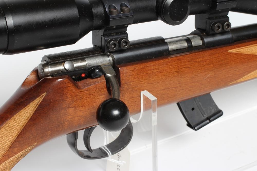 AN ANSCHUTZ .22LR BOLT ACTION RIFLE with 13" bull barrel, moderator, manual safety, ten shot Image