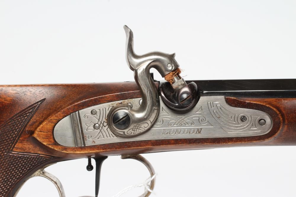 AN ARMI SPORT PERCUSSION .45 TARGET PISTOL with 10 1/4" octagonal barrel, stepped action, chequered Image