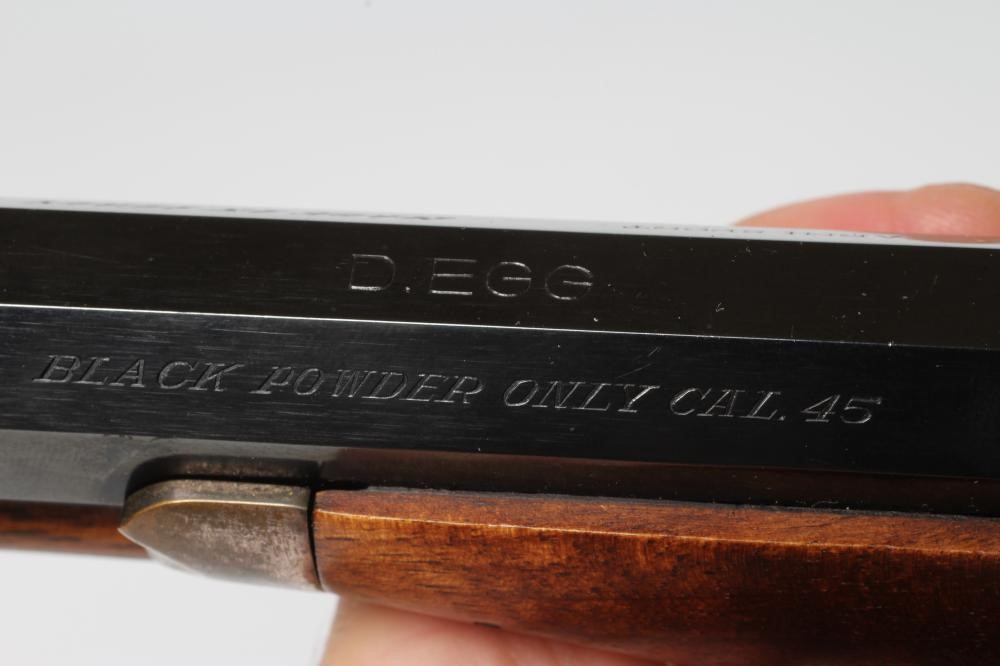 AN ARMI SPORT PERCUSSION .45 TARGET PISTOL with 10 1/4" octagonal barrel, stepped action, chequered Image