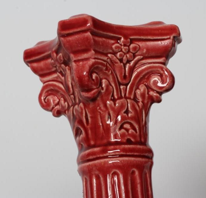 A PAIR OF BURMANTOFTS PINK GLAZED FAIENCE CORINTHIAN COLUMN CANDLESTICKS, c.1900, with fixed sconces Image