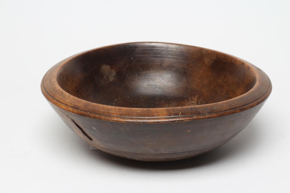 A TREEN DAIRY BOWL, 19th century, with incised line banding, 14 1/2" wide (Est. plus 24% premium Image