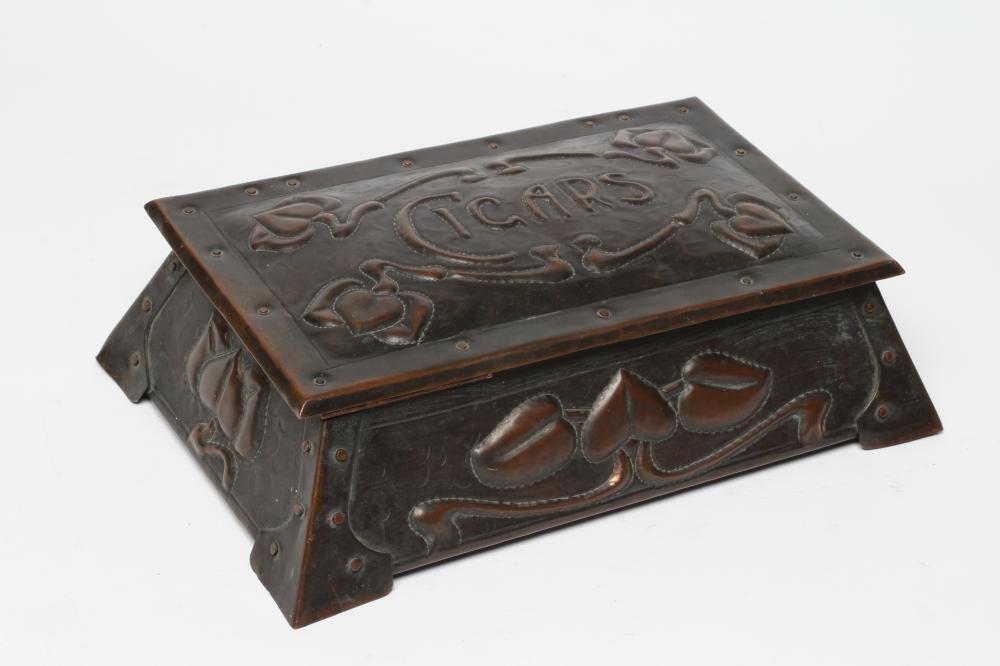 A CORNISH ARTS AND CRAFTS COPPER CIGAR BOX of sarcophagus form with rivet banding and repoussé with Image