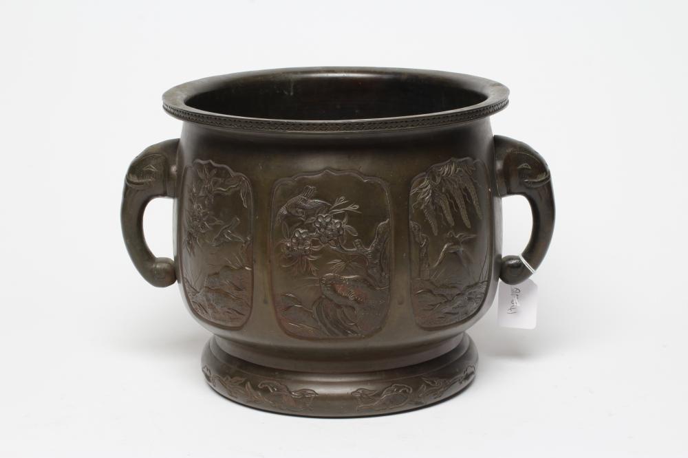 A CHINESE BRONZE JARDINIERE, c.1900, of circular form with flared rim and elephant mask handles, Image