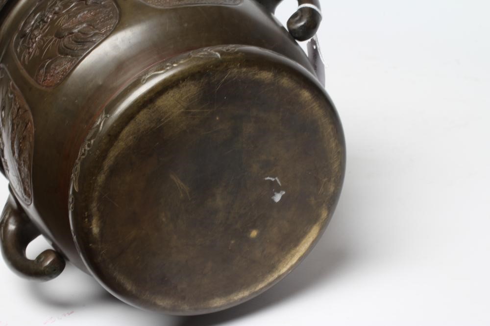 A CHINESE BRONZE JARDINIERE, c.1900, of circular form with flared rim and elephant mask handles, Image