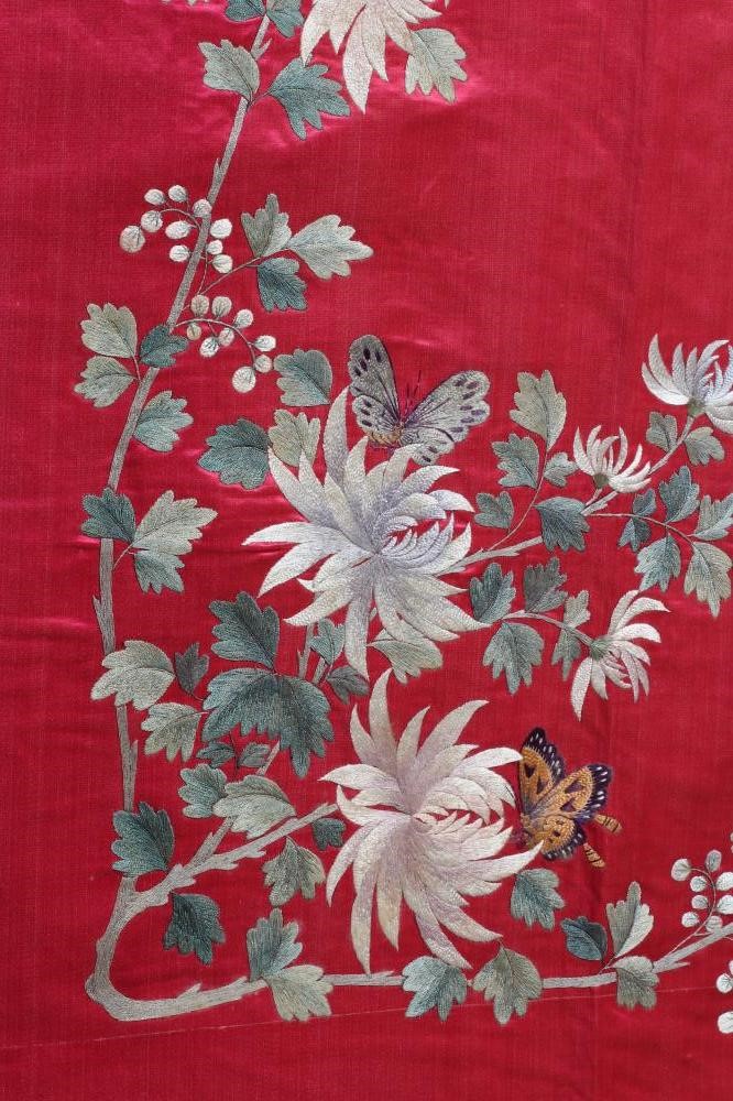 A LARGE CHINESE PINK SILK PANEL embroidered in coloured silks with a central roundel of a pair of Image