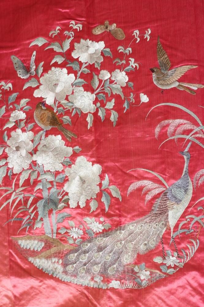 A LARGE CHINESE PINK SILK PANEL embroidered in coloured silks with a central roundel of a pair of Image