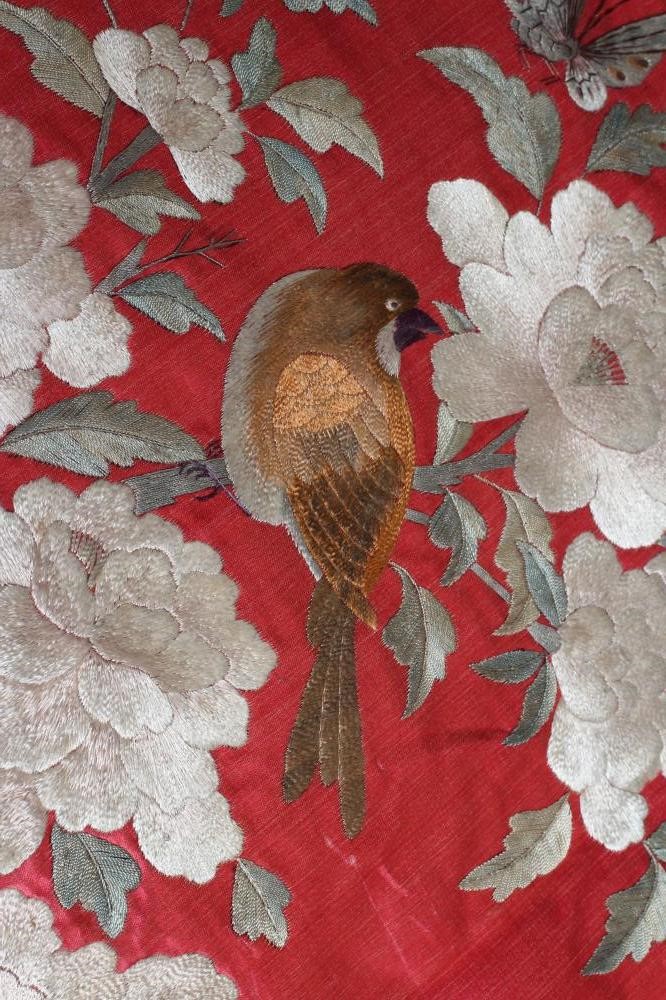 A LARGE CHINESE PINK SILK PANEL embroidered in coloured silks with a central roundel of a pair of Image