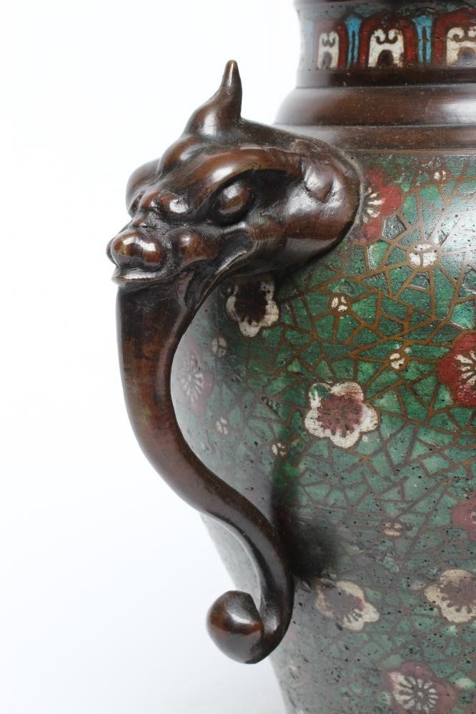 A CHINESE CLOISONNE ENAMEL VASE AND COVER of inverted baluster form with mask scroll handles Image