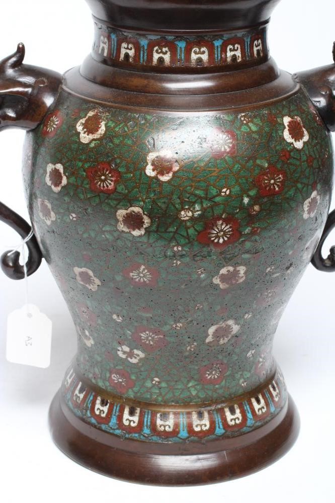 A CHINESE CLOISONNE ENAMEL VASE AND COVER of inverted baluster form with mask scroll handles Image