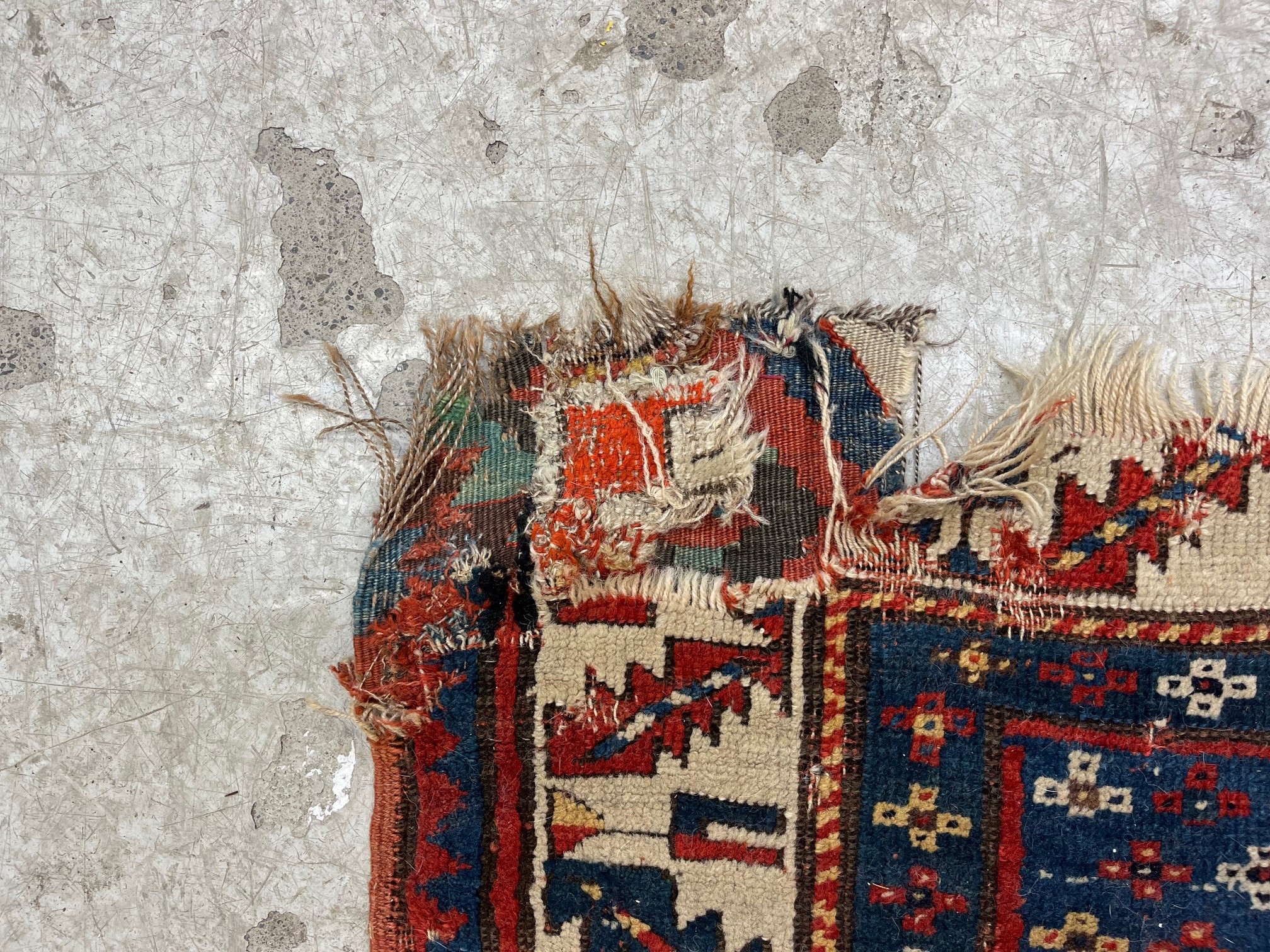 A KAZAK TRIBAL RUG, early 20th century, the indigo field with four linked guls in shades of blue, Image