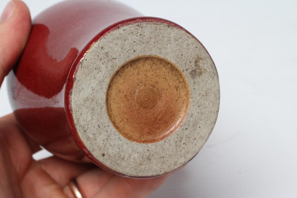 A CHINESE STONEWARE RED FLAMBE GLAZED MEIPING VASE, unmarked, 5" high (Est. plus 24% premium inc. Image
