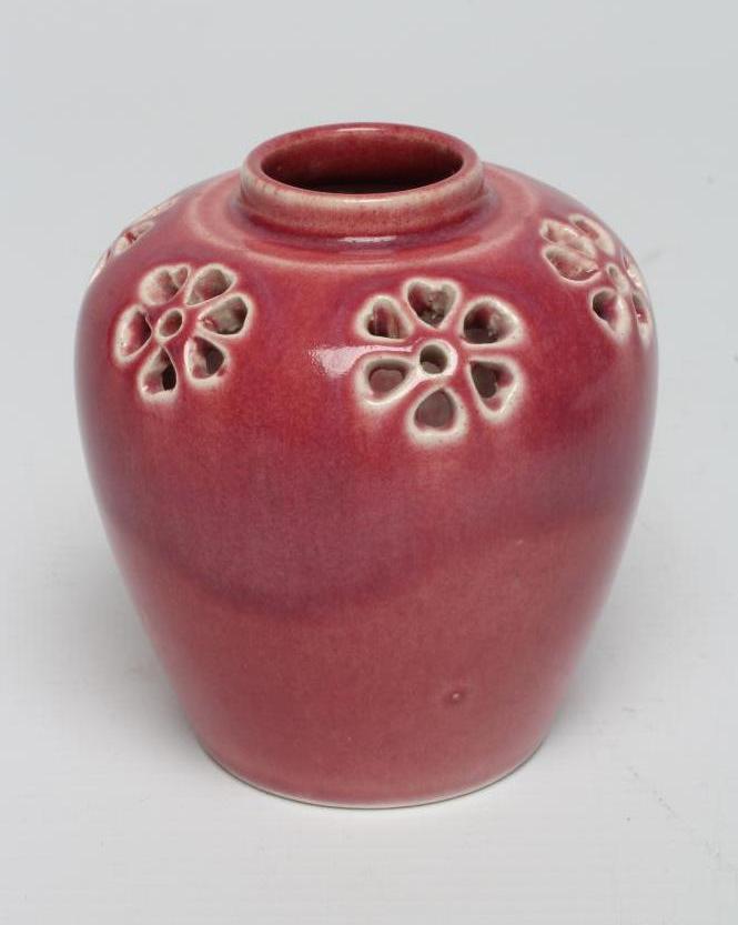 A RUSKIN PINK GLAZED EARTHENWARE SMALL POT POURRI, 1908, of ovoid form, the rounded shoulders Image