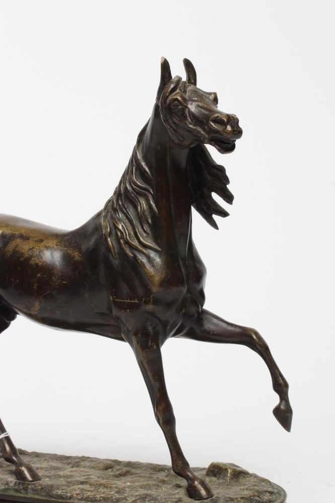A BRONZE STUDY OF A STALLION, possibly French, 20th century, standing with near front leg raised, on Image