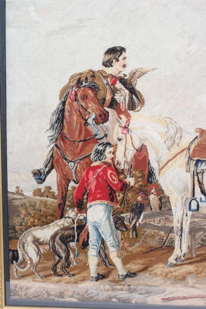 A VICTORIAN WOOLWORK PICTURE worked in half cross stitch with a Falconer seated astride his steed Image