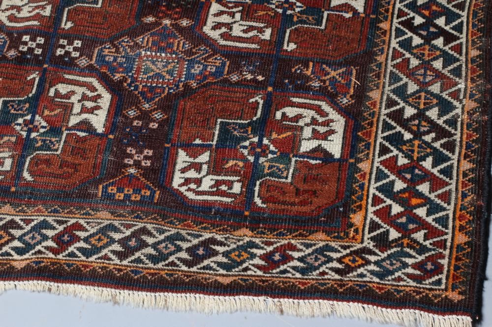 A TURKOMAN RUG, early/mid 20th century, finely woven with three rows of repeating linked quartered Image