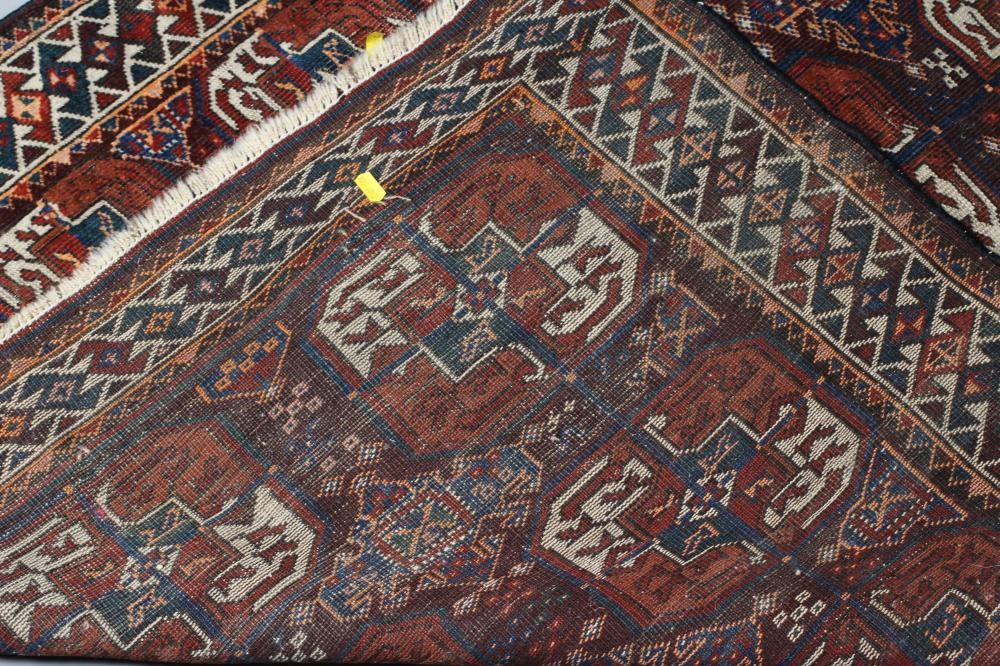 A TURKOMAN RUG, early/mid 20th century, finely woven with three rows of repeating linked quartered Image