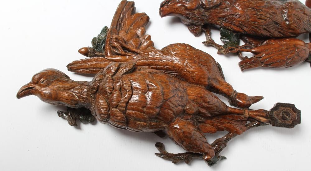 THREE EUROPEAN CARVED AND STAINED OAK WALL APPLIQUES, early 20th century, depicting hanging game Image
