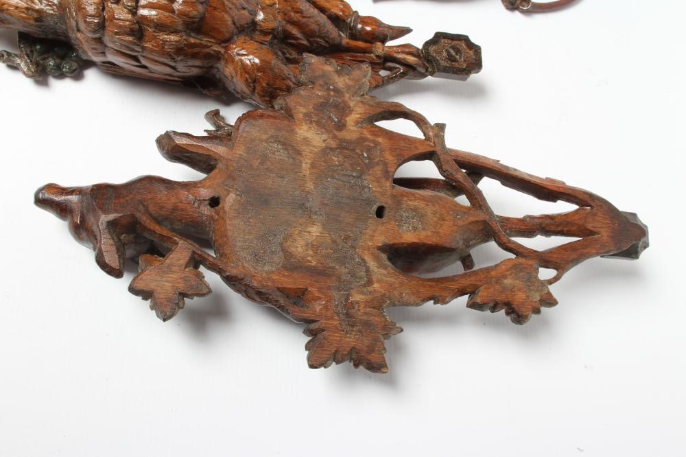THREE EUROPEAN CARVED AND STAINED OAK WALL APPLIQUES, early 20th century, depicting hanging game Image