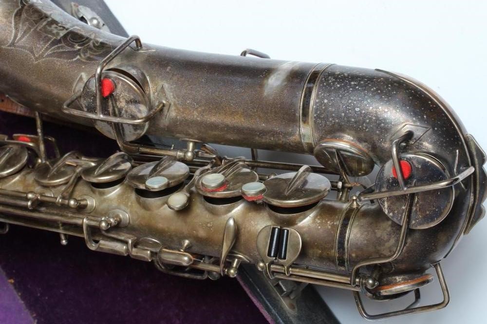 A BUESCHER SILVER PLATED SAXOPHONE, C-Melody, marked Low Pitch, with True-Tone logo and reg. no. Image