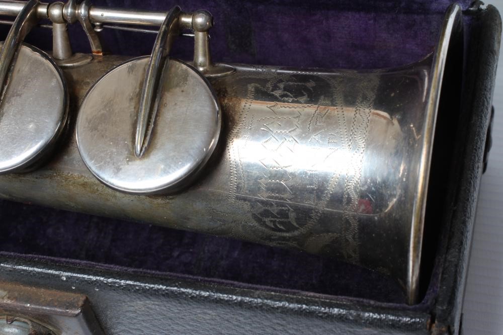 A BUESCHER SILVER PLATED SOPRANO SAXOPHONE, marked Low Pitch, with True-Tone logo and reg. no. Image