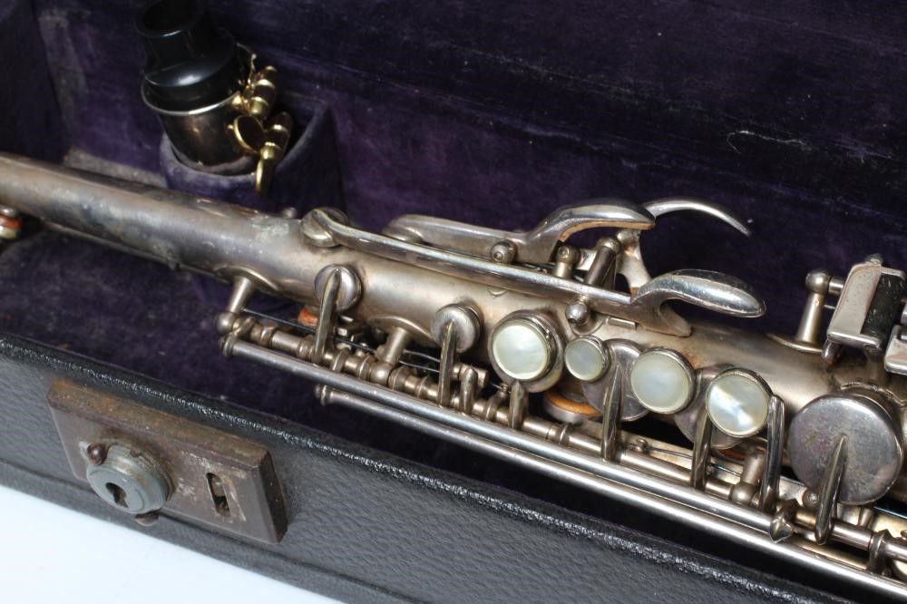 A BUESCHER SILVER PLATED SOPRANO SAXOPHONE, marked Low Pitch, with True-Tone logo and reg. no. Image